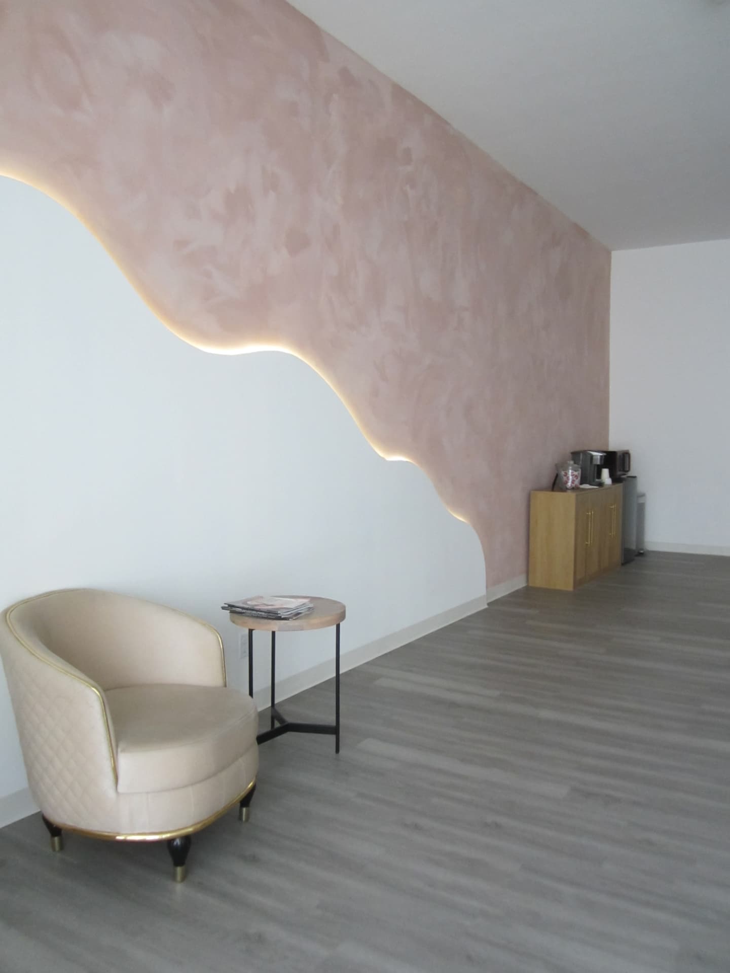 Cozy lounge chair beside the accent wall