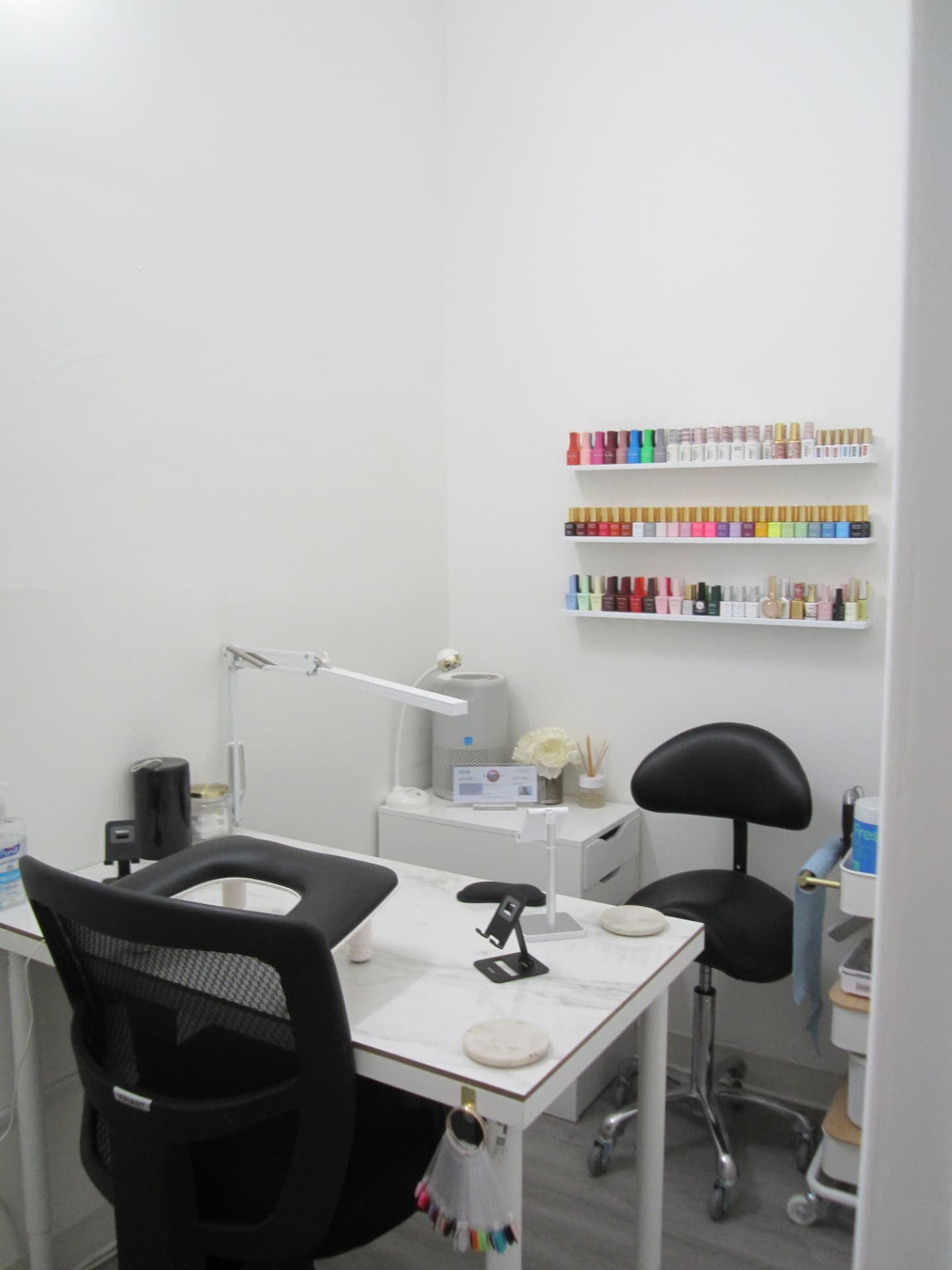 Nail station with polish display shelves